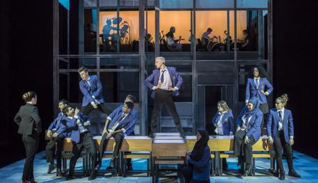A production image of the cast of Everybody's Talking About Jamie dancing on tables on the Crucible Stage