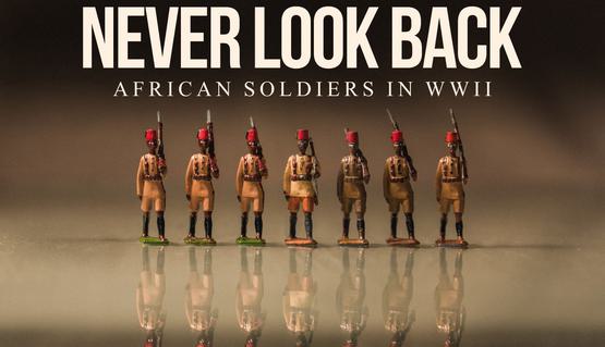 Promotional artwork for Never Look Back. Seven wooden soldier figures wearing brown military uniforms and red fezs march in a line holding rifles. Text reads "African Soldiers in World War 2"