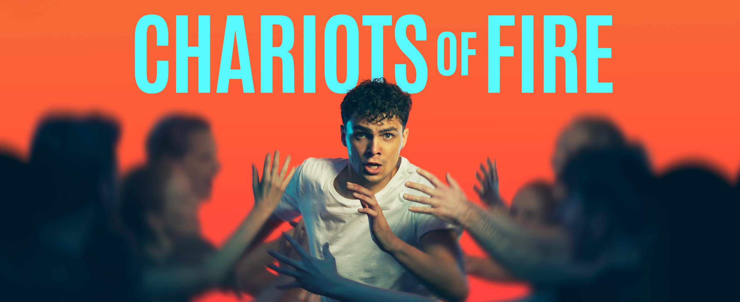 Promotional image for Chariots of Fire. Against a bright orange background, a young man runs with determination through a wave of blurred arms. Text reads: CHARIOTS OF FIRE