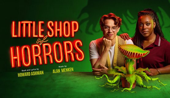 Against a dark green background, two people stand behind a green plant with tentacle-like leaves and fronds in the shape of a mouth with teeth. In luminous orange, text reads: LITTLE SHOP OF HORRORS.