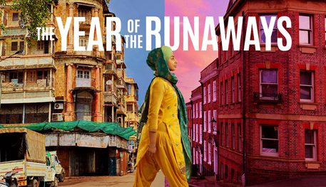 A person wearing loose yellow clothes and a green headscarf steps forward. Behind them is a bright image of India, in front is a corner of a Sheffield street. Text reads: THE YEAR OF THE RUNAWAYS