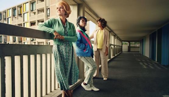 Standing at the Sky's Edge artwork with three women in period clothing from different times at the Park Hill flats.