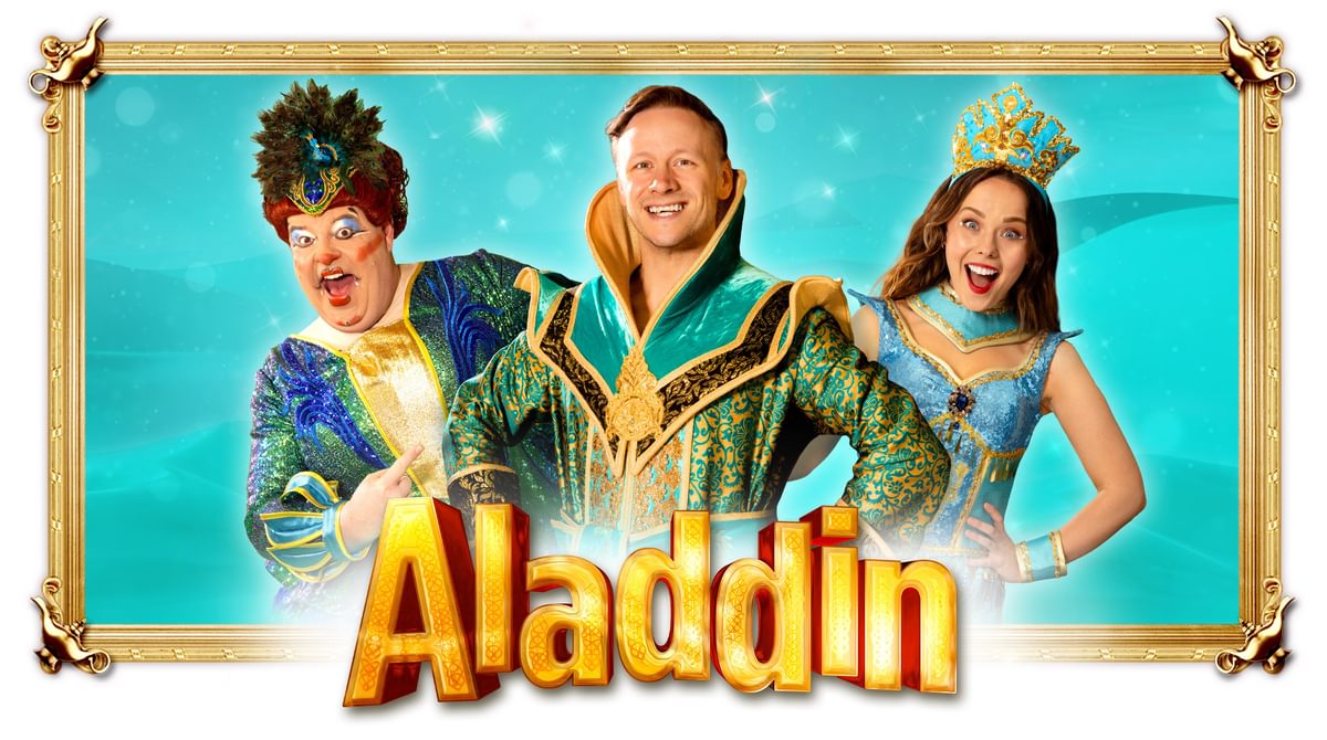 Three people wearing blue, green and gold pantomime clothes smile above the title ALADDIN