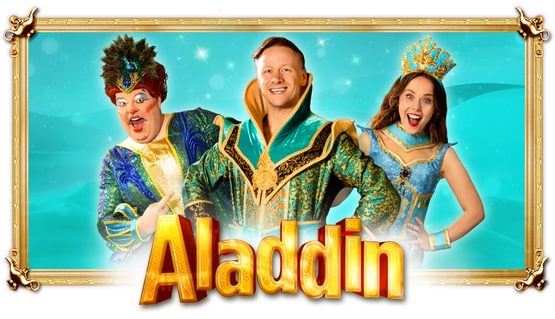 Three people wearing blue, green and gold pantomime clothes smile above the title ALADDIN