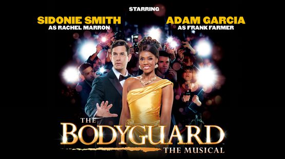 Text reads: 'The Bodyguard The Musical. Starring Sidonie Smith and Rachel Marron and Adam Garcia as Frank Farmer'. There is a woman wearing a gold dress and a man wearing a suit and tie. The woman is wearing elaborate jewellery and is smiling. The man has his hand out in front of her. There are paparazzi taking photos of her behind them.