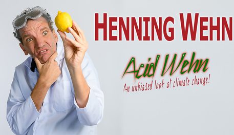 Promotional artwork featuring Henning Wehn wearing a white shirt and science goggles on his head. He holds a lemon and looks confused. Text reads "An unbiased look at climate change!"
