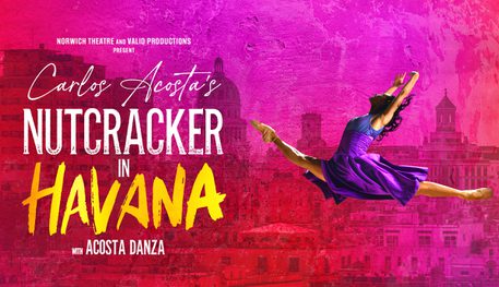 Promotional image for Carlos Acosta's Nutcracker in Havana. In front of a pink cityscape background, a female dancer jumping in the air with her legs open and arms held upward.