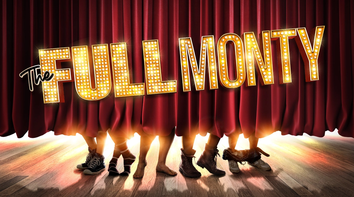 Promotional image for The Full Monty featuring a stage curtain slightly lifted to reveal five pairs of men's feet and the bottom of their bare legs. Some wear shoes and others have socks on.