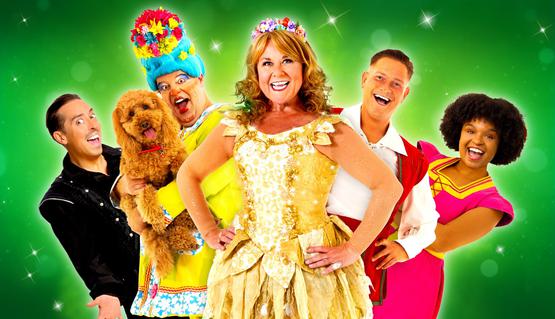 Promotional image with sparkly green background and 5 cast members in panto costumes. From left to right: Mark Pickering, Damian Williams as the Dame holding Waffle the Wonder Dog, Wendi Peters, Maxwell Thorpe and Sarah Freer.