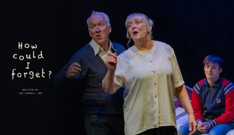 Production image for How Could I Forget featuring a man and woman, both with grey hair, talking animatedly. A younger man wearing a tracksuit jacket sits on a bed behind them.