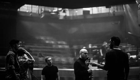 Artistic Director Rob Hastie and the company of Julius Ceasar on stage.